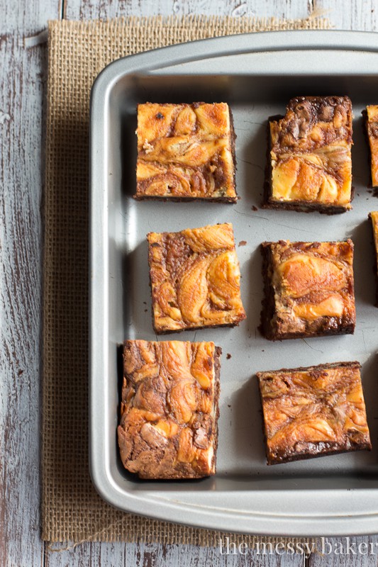 Turtle Cheesecake Swirl Brownies from www.themessybakerblog.com