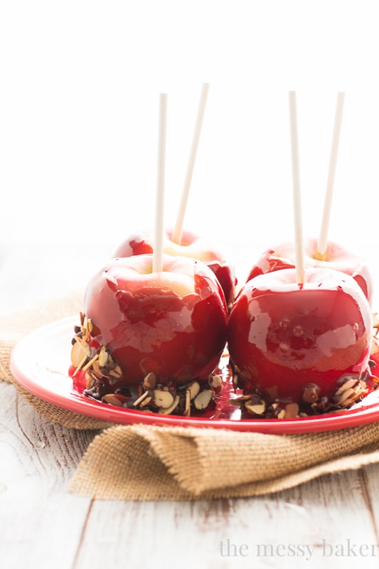 Red Moscato Candied Apples Dipped in Toasted Almonds and Semi-Sweet Chocolate | www.themessybakerblog.com