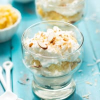 Pina Colada Fool | This no-bake dessert is layered with whipped cream, sweet pineapple, and toasted coconut and almonds. It's ready to serve in 10 minutes.